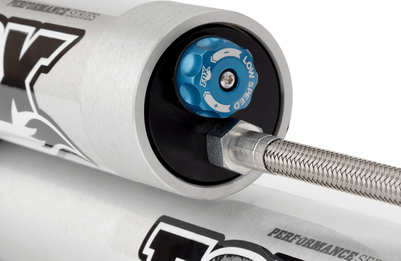 Fox Performance Series 2.0 Smooth Body Reservoir Shock - Adjustable - 985-26-118 close-up of blue low-speed adjuster knob with stainless steel braided line