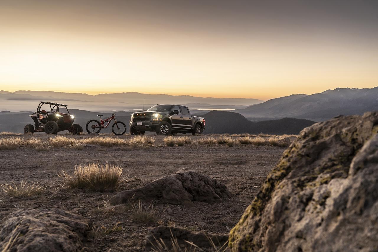 Fox Performance Series 2.0 Smooth Body Ifp Shock - 985-24-240 installed on off-road truck at dusk terrain