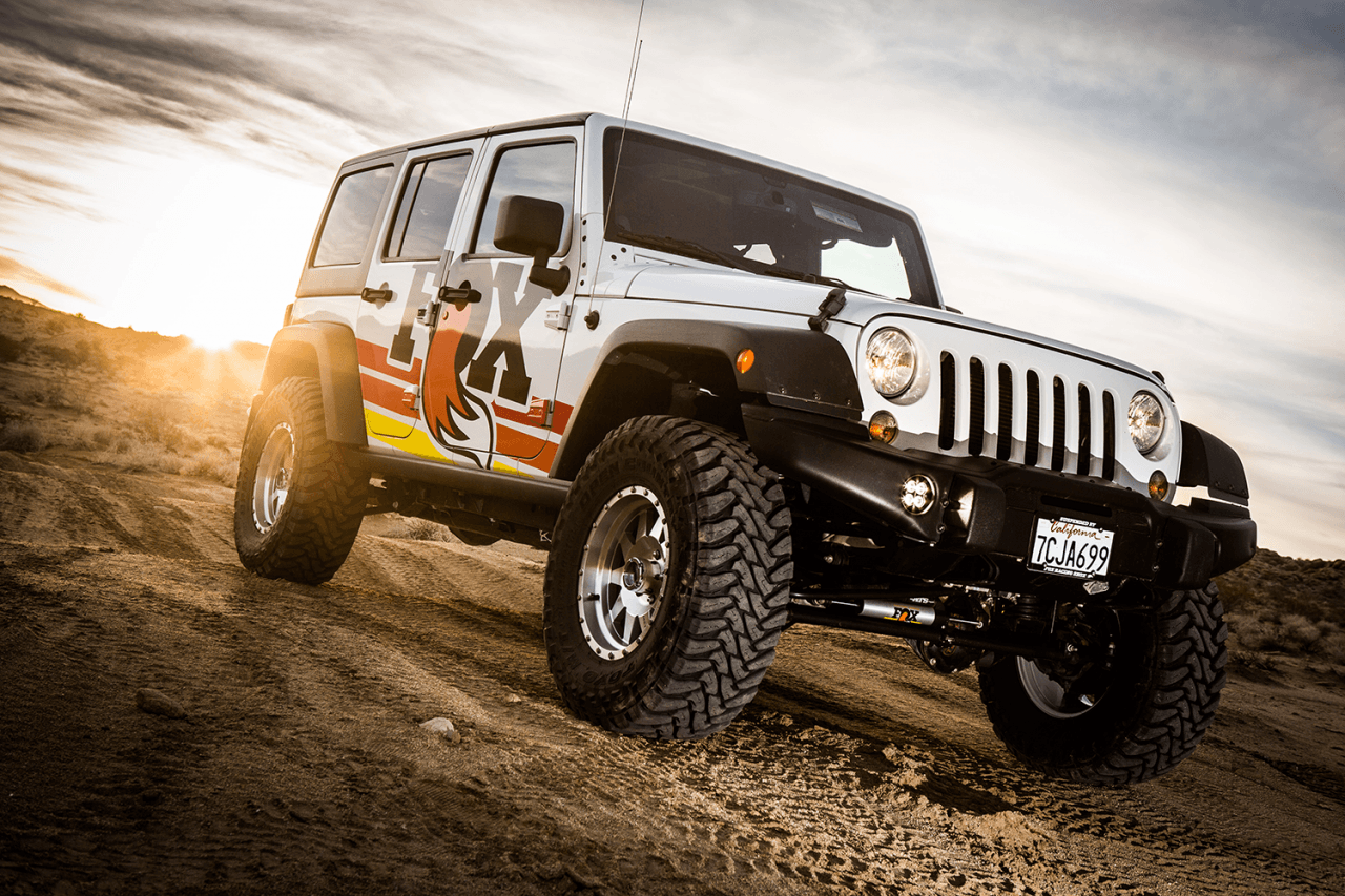 Fox Performance Elite Series 2.5 Reservoir Shock (Pair) - Adjustable - 883-26-094 on lifted 4-door Jeep Wrangler off-road tires