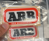 215611SP - SP BADGE ARB DOMED 94 X 43MM by Mudify, heavy-duty 4x4 accessory emblem in domed finish for off-road vehicles.