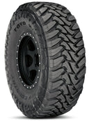 Toyo Open Country Mt - 285/65-18 tire with aggressive tread pattern designed for heavy-duty off-road traction and durability