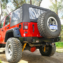Load image into Gallery viewer, A red Old Man Emu jeep wrangler is parked on a dirt road, boasting the ARB Old Man Emu Rear Nitrocharger Sport Shock 60067 for Jeep Wrangler JK (2007-2018)- All Models for optimal performance.