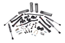 Load image into Gallery viewer, A JKS suspension system for a Jeep Wrangler JK (06-18) 2 Door with excellent offroad articulation and optimized steering angles, featuring durable springs.