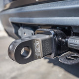 A black truck with a Factor 55 HitchLink 2.0in Silver 00020-05 attached to it.
