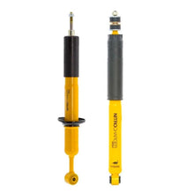 Load image into Gallery viewer, A pair of yellow and black Old Man Emu shock absorbers with excellent rebound and compression performance on a white background.