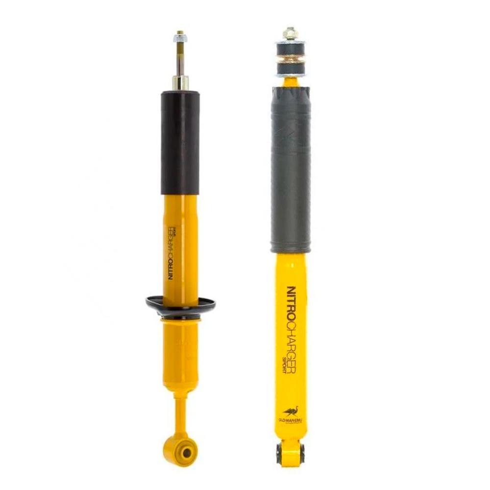 A pair of yellow and black Old Man Emu Rear Nitrocharger Sport Shocks featuring high-quality oil on a white background.