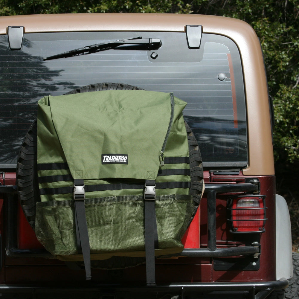 A Trasharoo Spare Tire Trash Bag on the back of a jeep.