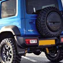Load image into Gallery viewer, The rear end of a blue SUV, featuring easy installation, equipped with the ARB Rear Coil Springs 3146 for Suzuki Jimny (2018-2021) 4th GEN - CYL. 1.5L PETROL ENGINE by Old Man Emu.