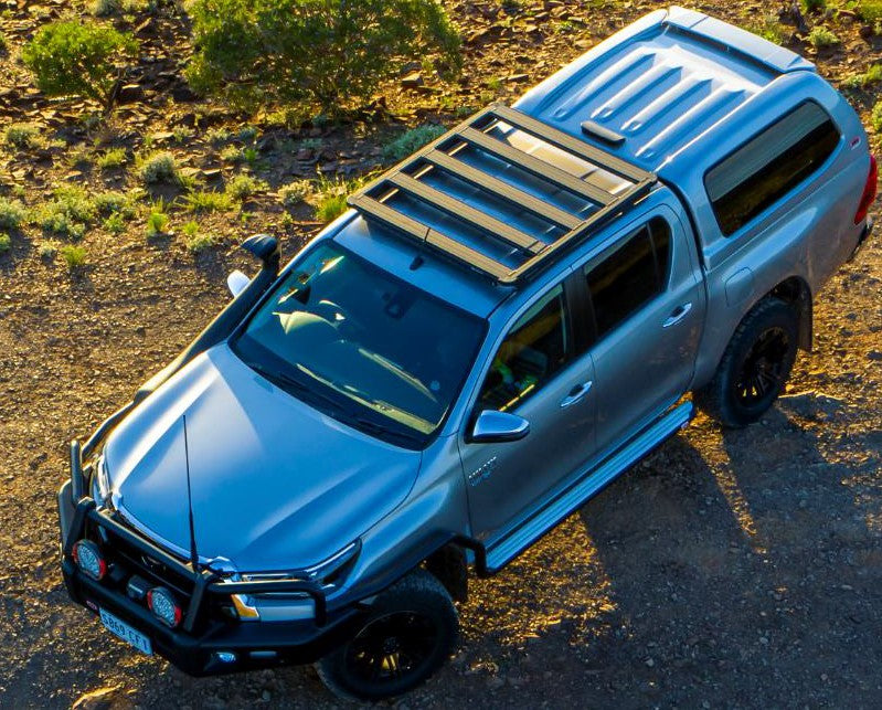 Toyota hilux roof rack with ARB CROSSBARS and ARB Base Rack (49" x 45") 1770060 for enhanced functionality.