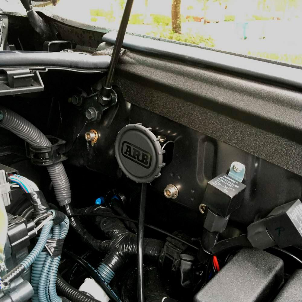 The interior of a jeep wrangler features an ARB Differential Breather Kit 170112, giving it a sleek and durable look with its anodized finish.