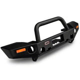 A deluxe ARB bull bar bumper providing front end protection for a Jeep Wrangler.
