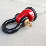 A red and black Factor 55 Shackle Mount in Red 00015-01 with a black handle, suitable for recovery straps.