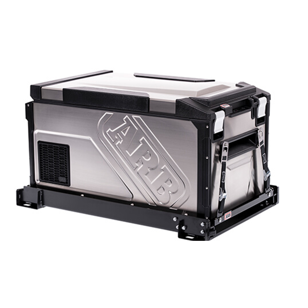 An ARB Fridge Tiedown Kit System ARB 10900010 secured on a vehicle with a tie-down system, placed against a white background.