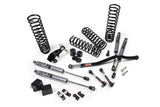 A JKS suspension system for a Jeep Wrangler JK (06-18) 4 Door J-Venture Lift Kit with offroad articulation and springs.