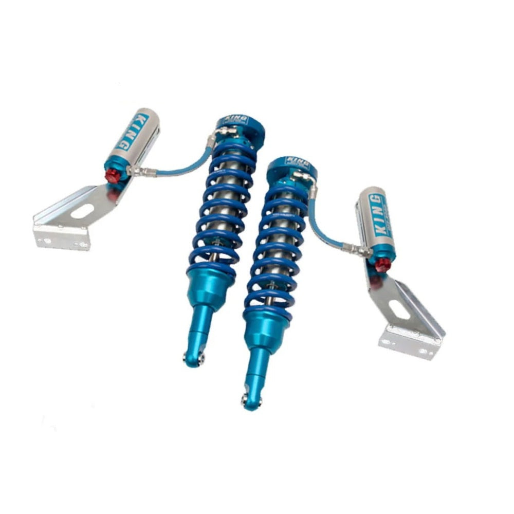 A pair of King Shocks Front 2.5 Remote Reservoir Coilover w/Adjuster on a white background, ideal for off-road performance enthusiasts or those interested in bolt-on suspension systems.