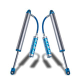 A pair of King Shocks Rear 2.5 Remote Reservoir Shocks (PAIR) for Toyota 4Runner, FJ Cruiser, Landruiser 200 Series on a white background.