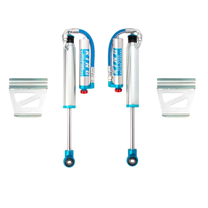 A lightweight pair of King Shocks Rear 2.5 Remote Reservoir Shocks w/Adjuster (PAIR) in blue and white with bolt-on installation.