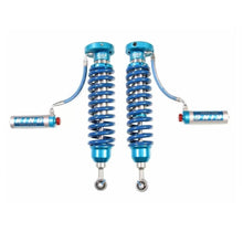 Load image into Gallery viewer, A pair of blue King Shocks 2.5 Front Coilover w/Remote Reservoir w/Adjuster (PAIR) for Toyota Tundra 2007-ON on a white background.