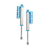 A pair of King Shocks Rear 2.5 Piggyback Reservoir Shock for RAM 1500 09-18 (4WD) with a high-quality materials upgrade kit on a white background.