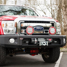 Load image into Gallery viewer, A red ARB Ford F-250 pickup truck with winch compatibility is parked in a parking lot.