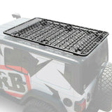 A jeep with a secure storage Alloy Flat Roof Rack 70” x 44” with Mesh Floor for Jeep Wrangler JL 2018-2019 ARB 4913020MKJL fitted using a fitting kit.