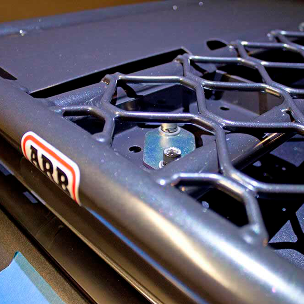 A close up of an ARB steel basket rack with mesh floor 87" X 44" on a Toyota Land Cruiser 200 Series 2008 - 2020.