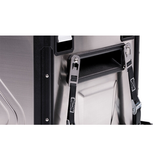 An ARB Fridge Tiedown Kit System ARB 10900010 securely fastened to a vehicle with a tie-down system.