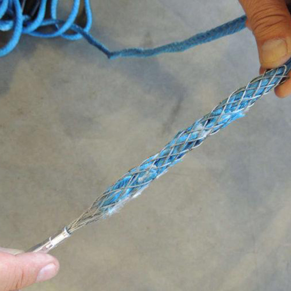 A person is holding a blue synthetic winch line with a Factor 55 Fast FID Kit 00420-01.