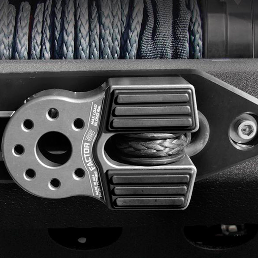 A close up of a Factor 55 FlatLink in Silver 00050-05 with a rope attached to it, suitable for product description purposes.