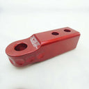 A Factor 55 HitchLink 2.0in Red 00020-01 lightweight red plastic handlebar bracket with two holes.