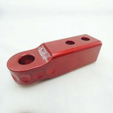 A Factor 55 HitchLink 2.0in Red 00020-01 lightweight red plastic handlebar bracket with two holes.