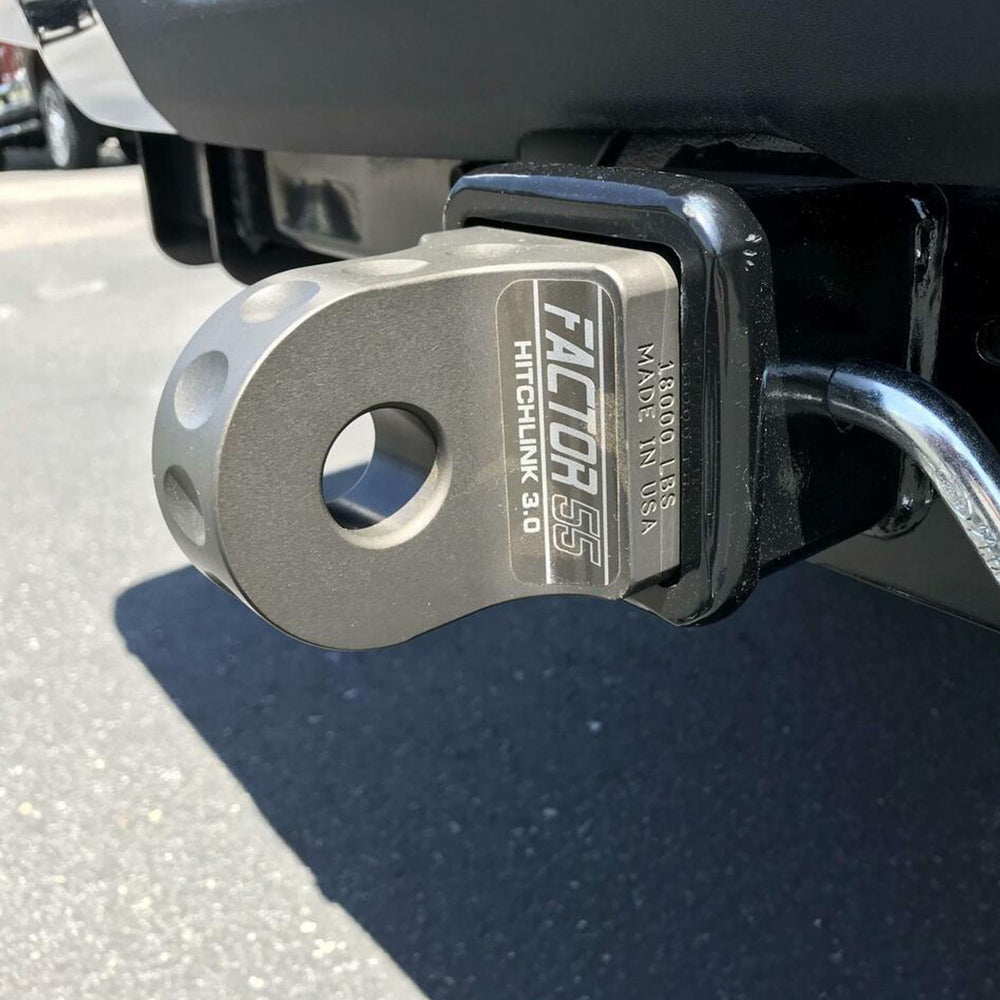A truck with a Factor 55 HitchLink 2.0in Silver 00020-05 hitch mounted on it, featuring a 9500 lb capacity and powder coated finish.