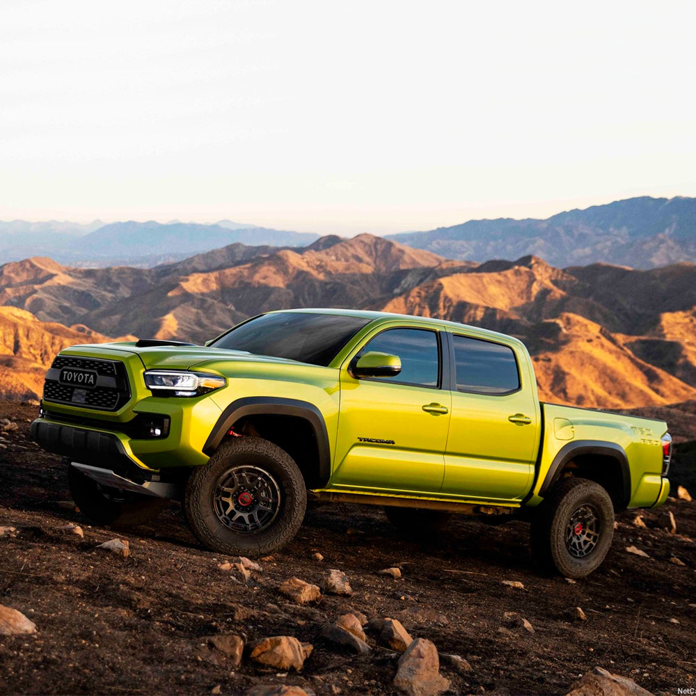 The 2019 Old Man Emu Toyota Tacoma provides great ride comfort while parked on a rocky mountain.
