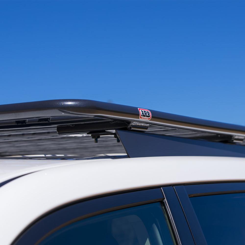 This car features a Steel Flat Rack 87” X 44” for Toyota Land Cruiser 200 Series 2008 - 2021 ARB 3800230KLC2, providing secure storage thanks to the fitting kit.