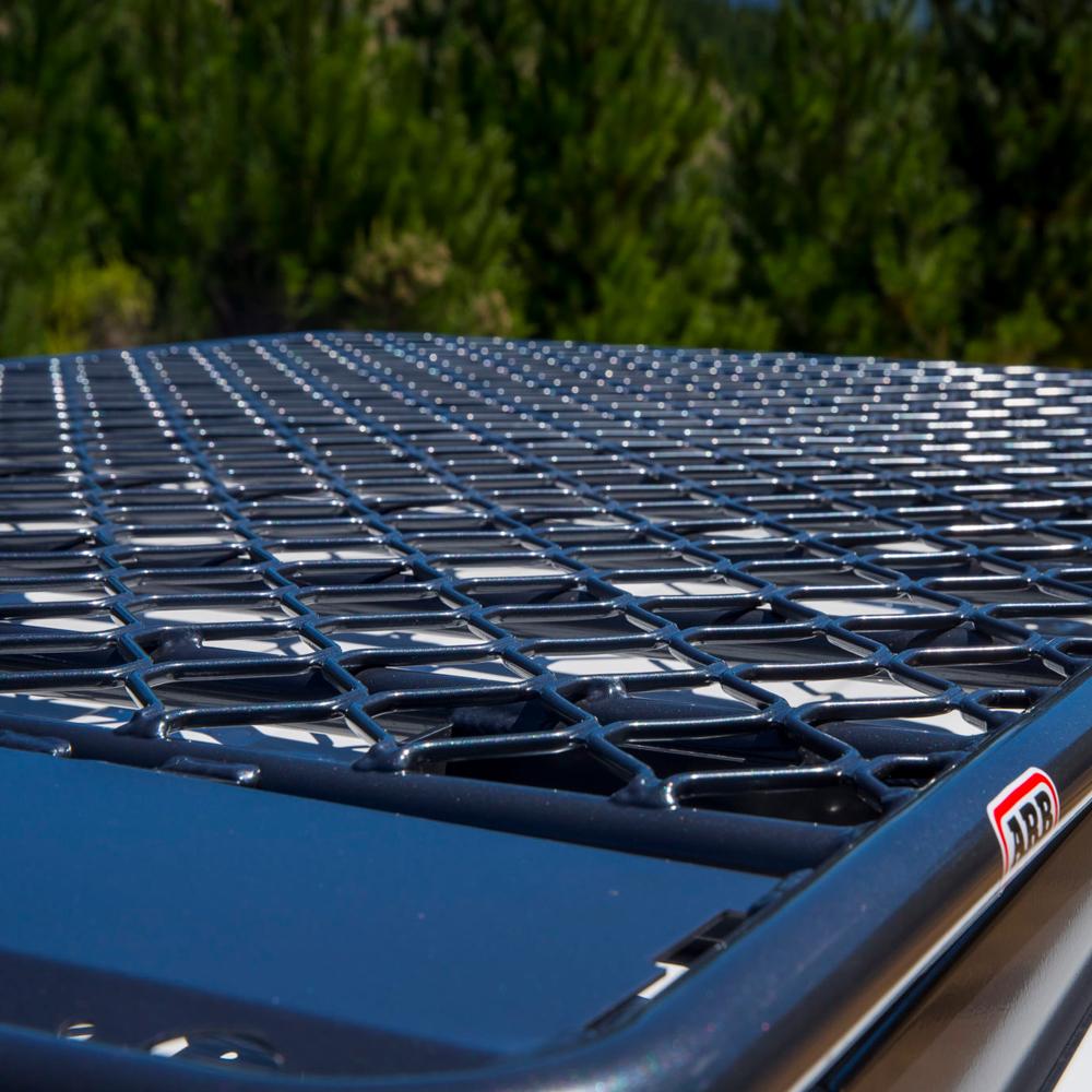 The ARB Steel Roof Rack for All Jeep CHEROKEE XJ 3800030K provides secure storage and is equipped with a fitting kit for easy installation.