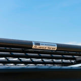 A close up of a black ARB roof rack with a fitting kit.