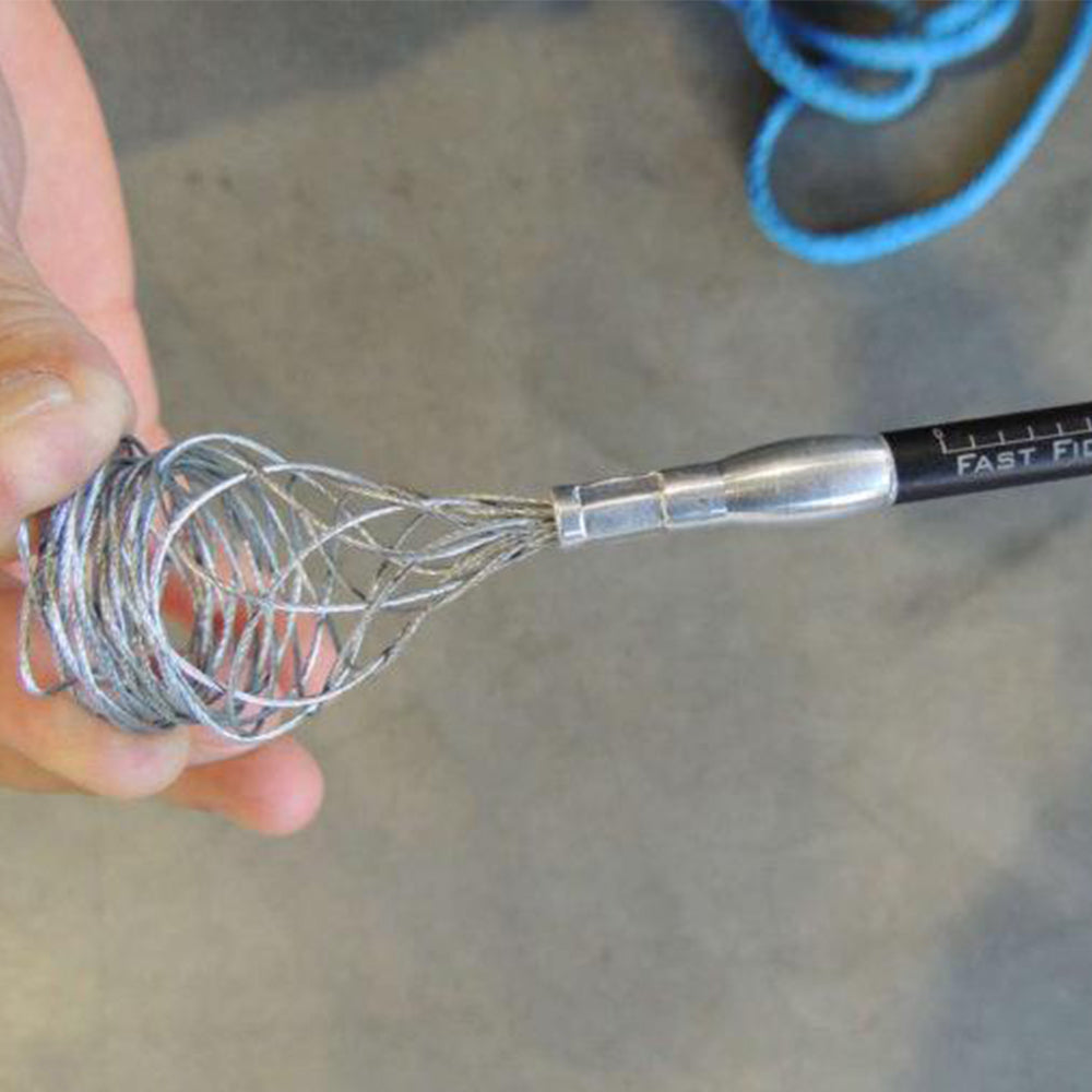 A person using a metal wire whisk while repairing a winch rope with a Factor 55 Fast FID Kit 00420-01.