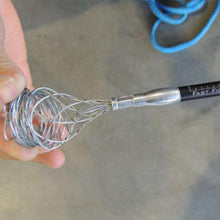 Load image into Gallery viewer, A person using a metal wire whisk while repairing a winch rope with a Factor 55 Fast FID Kit 00420-01.