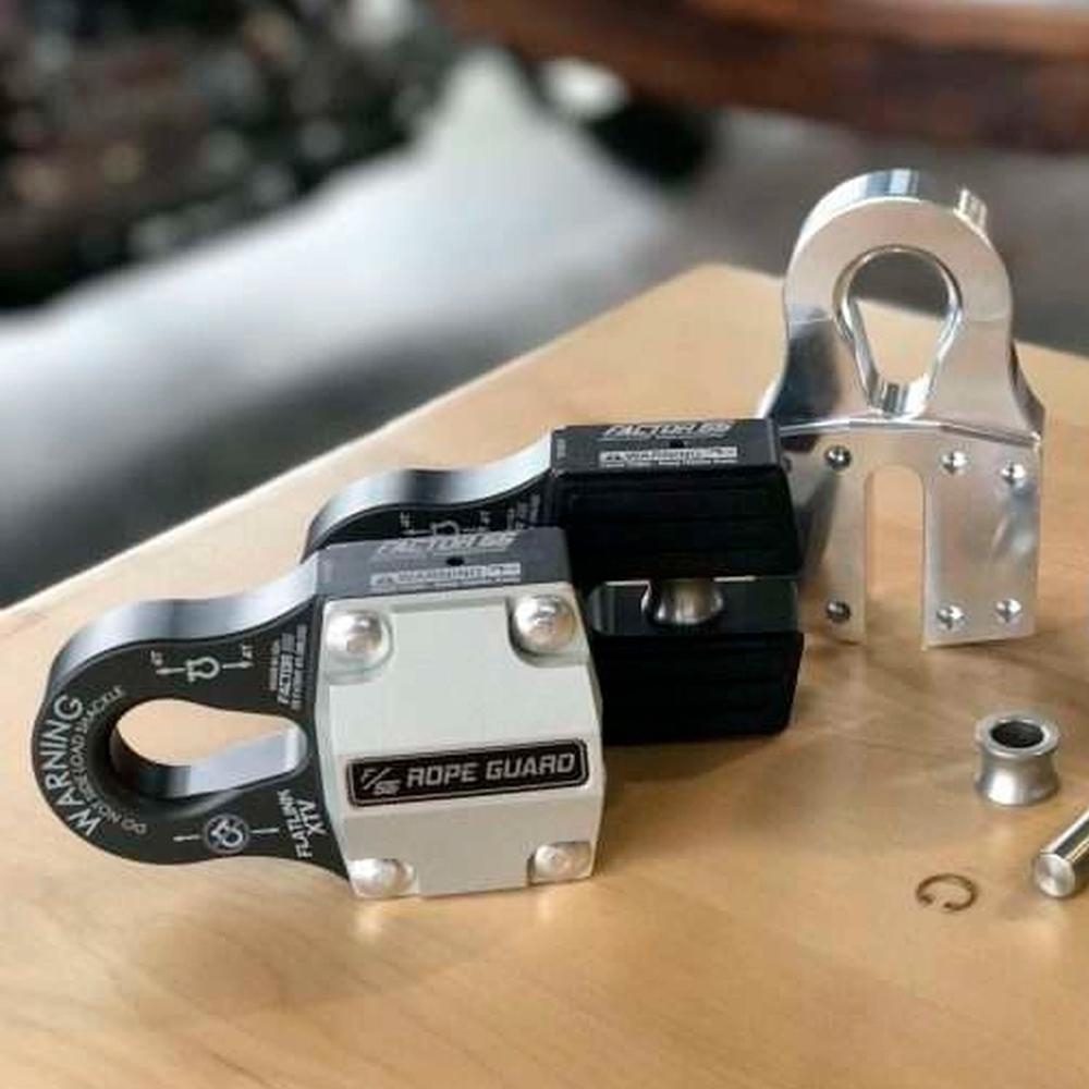 Two Factor 55 FlatLink XTV Rope Guards (UTV/ATV) 00383 on top of a wooden table providing synthetic rope protection.