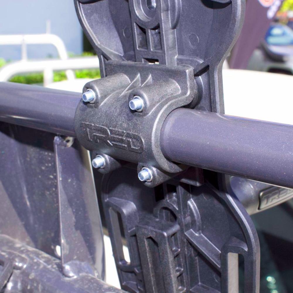 A close up image of a metal bracket attached to a vehicle, used for ARB Mount Adapter TRED TPMKBA02.