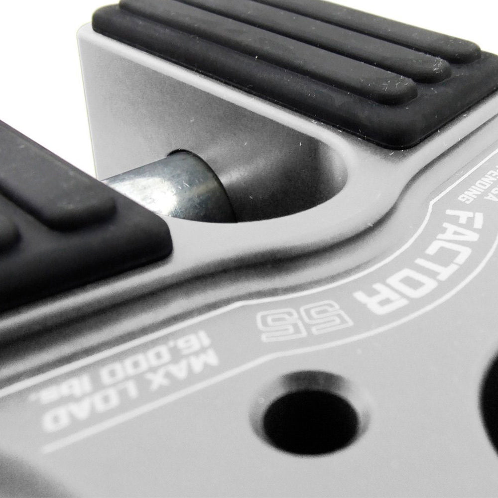 A close up of a Factor 55 FlatLink in Silver 00050-05 with a black knob on it for product description.