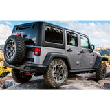 The Old Man Emu adjustable jeep wrangler is parked on a rock, supported by sturdy DOM steel tube control arms.