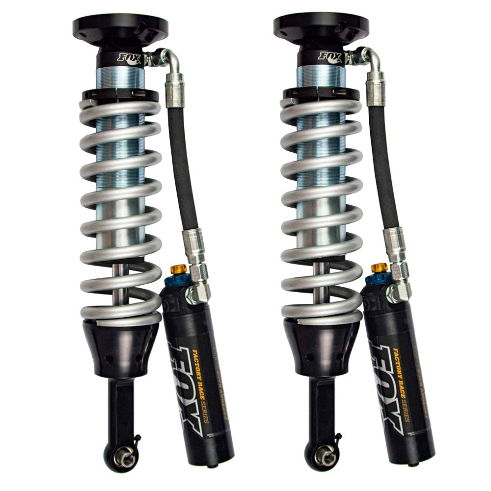 A pair of Fox Racing Front Factory Race Coil-Over Reservoir Shock 880-06-418 for Toyota Tacoma RWD and 4WD - ADJUSTABLE (Pair) with a long-lasting finish on a white background.