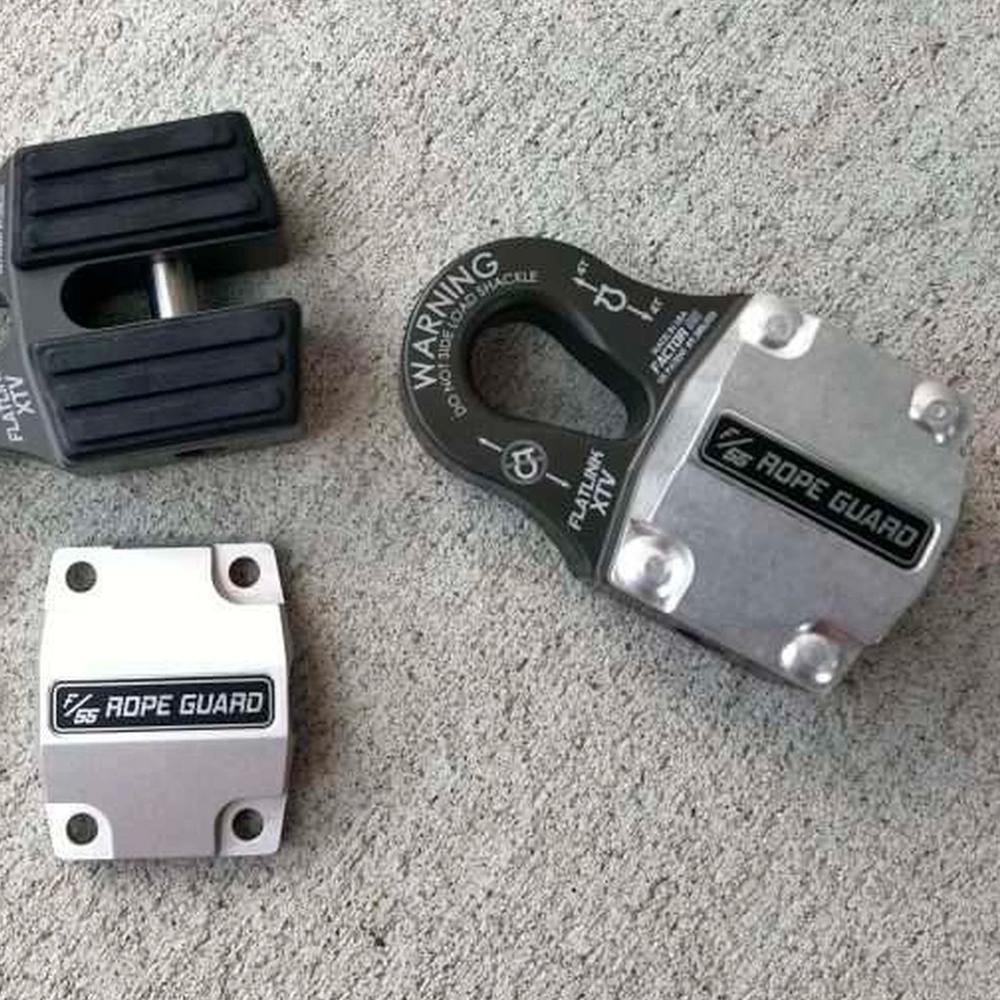 A pair of Factor 55 FlatLink XTV Rope Guards (UTV/ATV) 00383 on the floor providing synthetic rope protection against UV light impact.