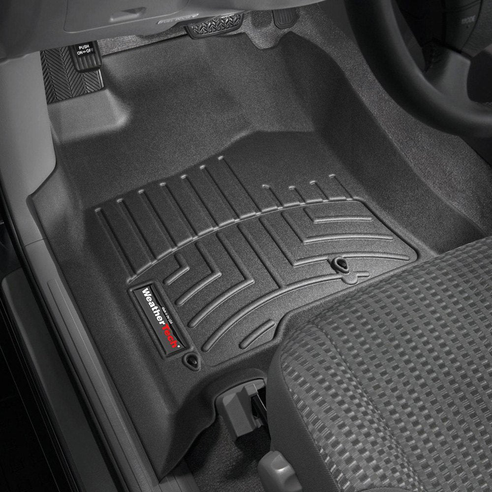 An advanced black Weathertech DigitalFit 1st Row Floor Liner providing exceptional floor protection in a car.
