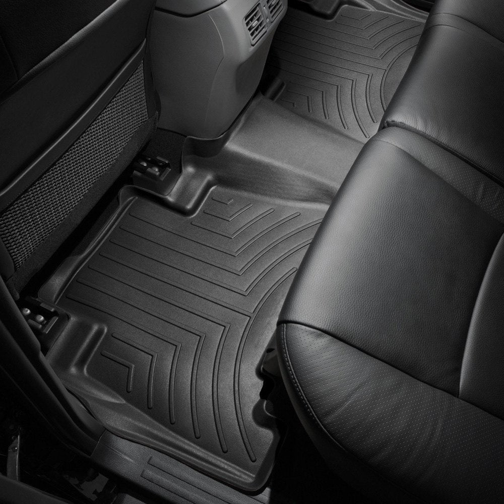A car with Weathertech Floorliner HP 2nd Row Floor Mats for Toyota 4Runner (2013-2023) in the back seat, perfect for extreme weather environments.