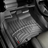 A car with Weathertech DigitalFit 1st Row Floor Liners for Toyota FJ Cruiser (2007-2016) by Weathertech.