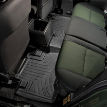 Load image into Gallery viewer, The Jeep Wrangler is now equipped with Weathertech DigitalFit 2nd Row Floor Liner for Toyota FJ Cruiser (2007-2016), providing advanced floor protection. Made from high-density, tri-extruded material, these liners are built to withstand.