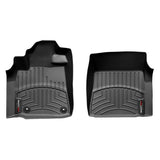 A pair of black Weathertech DigitalFit 1st Row Floor Liners for the Toyota Tundra (2014-2021), providing excellent floor protection.