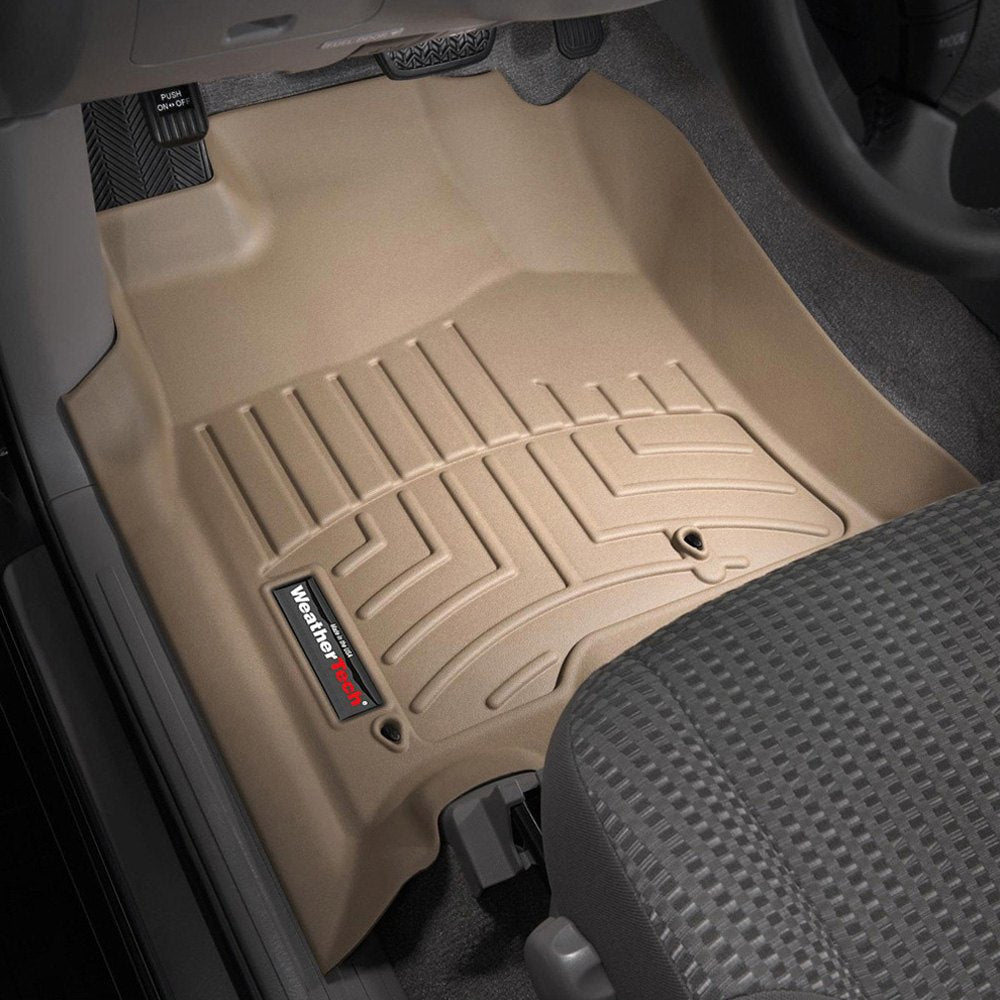 A beige Weathertech DigitalFit 1st Row Floor Liners for Toyota 4Runner (2003-2009) providing advanced floor protection in a car.